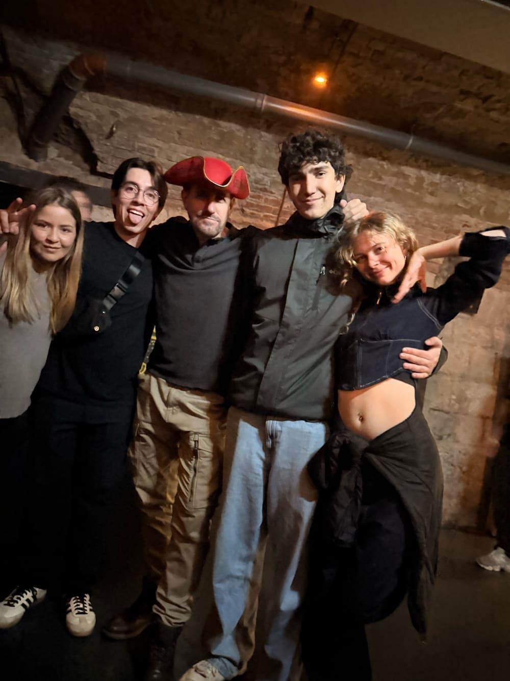 Group of friends posing together on a night out in Budapest with the Budapest Ruin Crawl