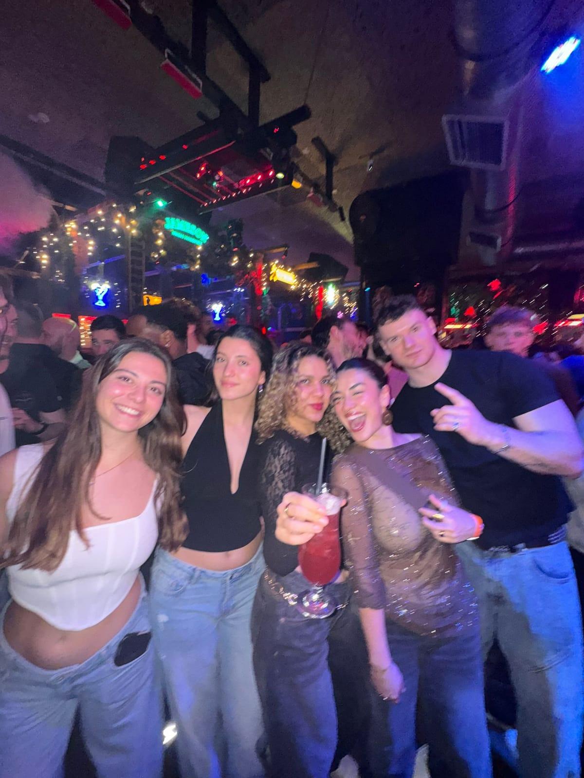 Neon ruin bar crowd on a Budapest Ruin Crawl night