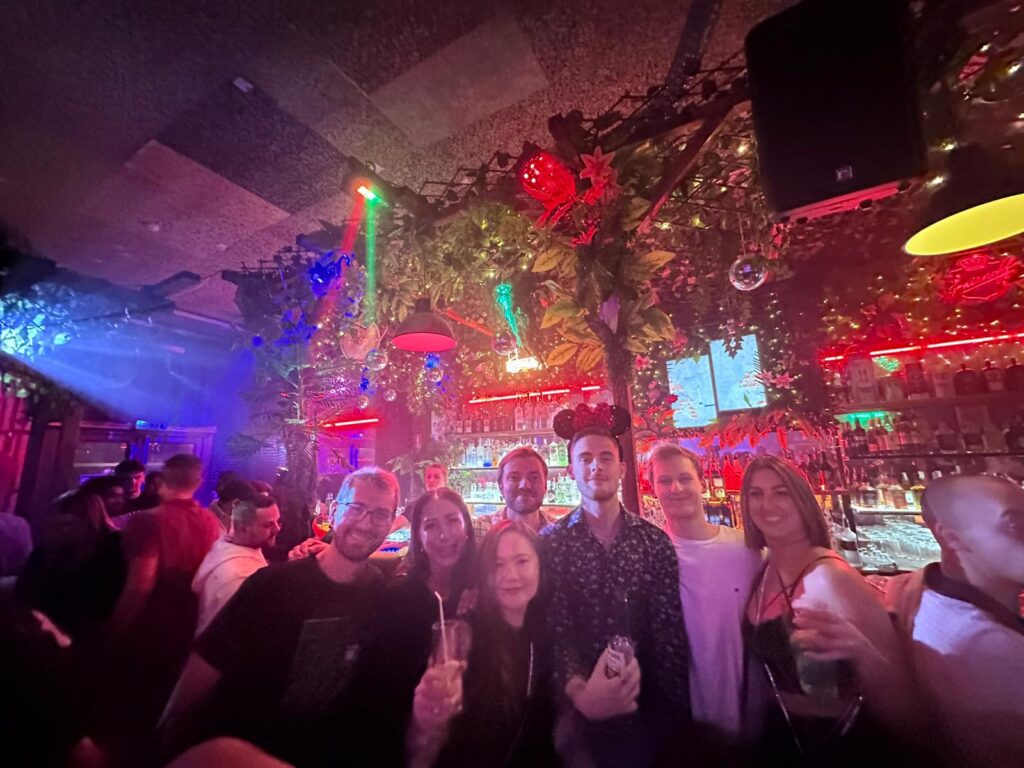 Participants sharing memorable moments during a Budapest pub crawl